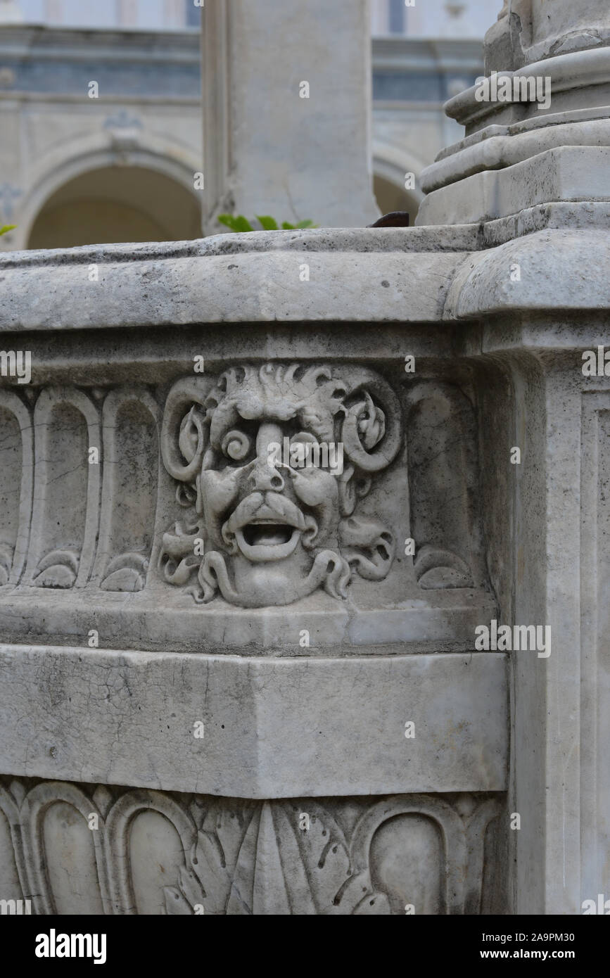 Anthropomorphic goat head motif decorates a water well inside the former monastery complex of Certosa di San Martino, Naples, Italy, Europe. Stock Photo