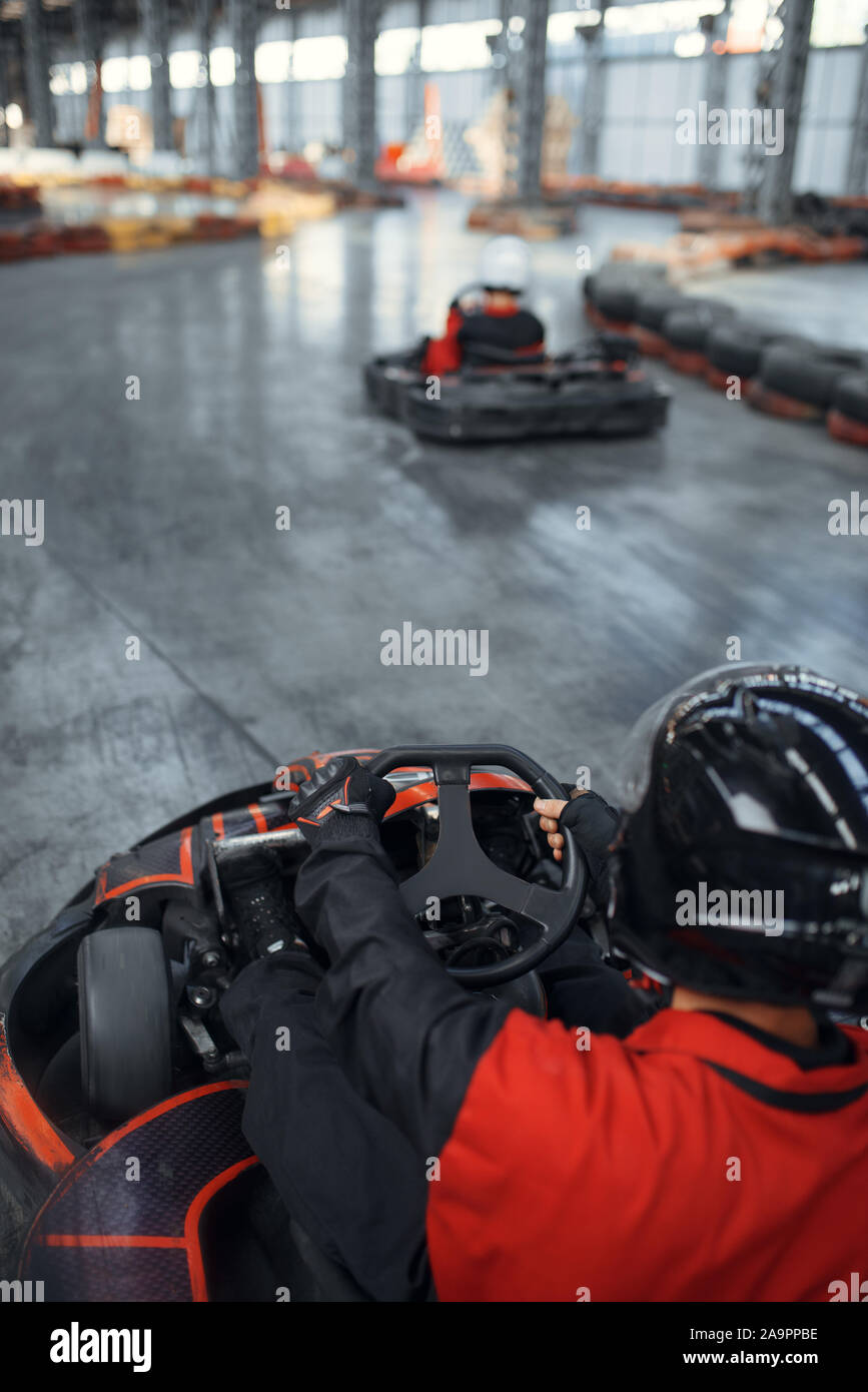 Racer in helmet driving go kart car Stock Photo Alamy