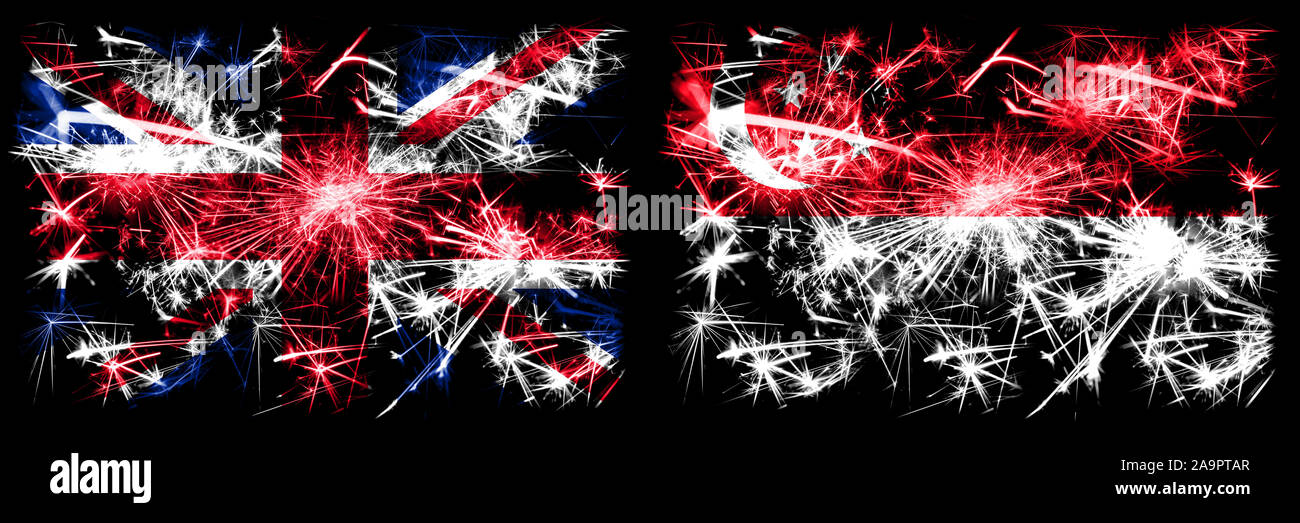 Great Britain, United Kingdom vs Singapore, Singaporean New Year celebration travel sparkling fireworks flags concept background. Combination of two a Stock Photo