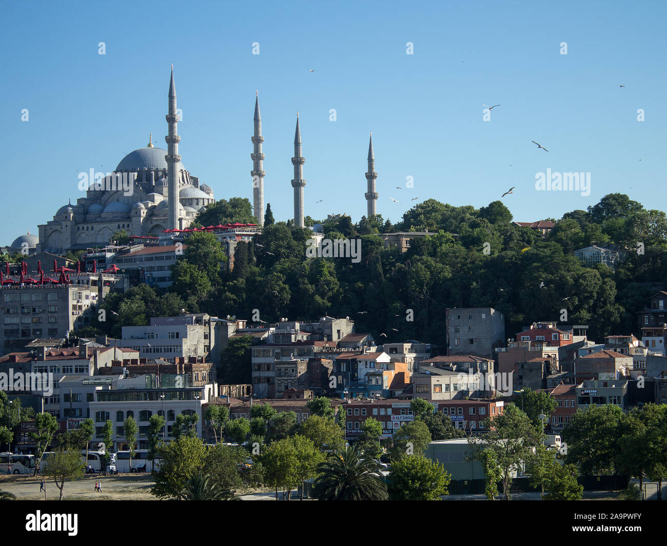 Suleymaniye, Istanbul, Turkey June 27th, 2019: Historical Suleymaniye Mosque and much deteriorated Suleymaniye District on a sunny day. Stock Photo