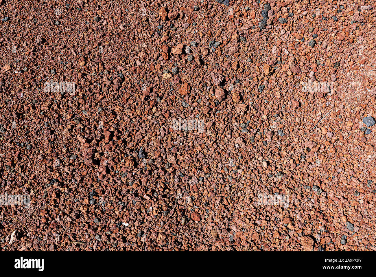 directly above shot of red volcanic soil background Stock Photo