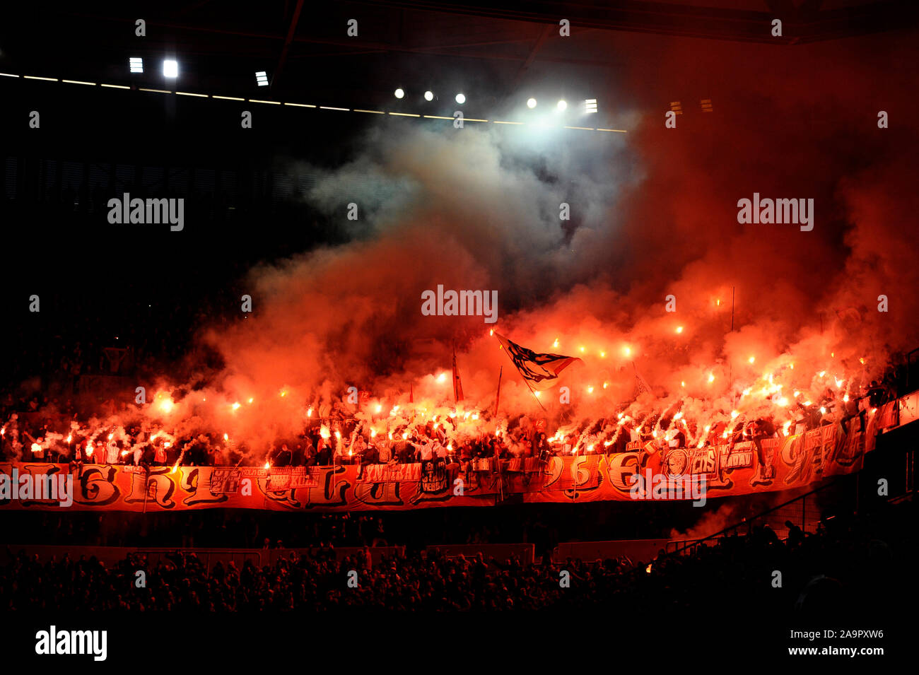 Merkur Spielarena Dusseldorf Germany, 3.11.2019,  Football: German Bundesliga Season 2019/20, matchday 10, Fortuna Dusseldorf (F95) vs 1.FC Koln (Cologne, CGN): the curve is burning: Cologne ultra supporters light up dozens of flares   DFL REGULATIONS PROHIBIT ANY USE OF PHOTOGRAPHS AS IMAGE SEQUENCES AND/OR QUASI-VIDEO Stock Photo