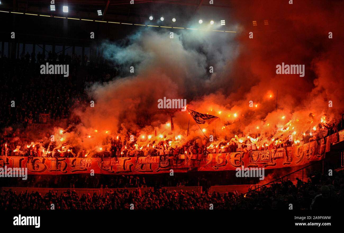 Merkur Spielarena Dusseldorf Germany, 3.11.2019,  Football: German Bundesliga Season 2019/20, matchday 10, Fortuna Dusseldorf (F95) vs 1.FC Koln (Cologne, CGN): the curve is burning: Cologne ultra supporters light up dozens of flares   DFL REGULATIONS PROHIBIT ANY USE OF PHOTOGRAPHS AS IMAGE SEQUENCES AND/OR QUASI-VIDEO Stock Photo