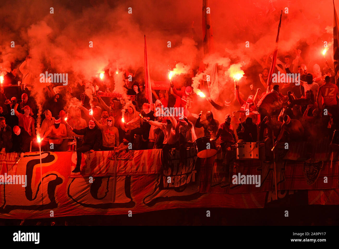 Merkur Spielarena Dusseldorf Germany, 3.11.2019,  Football: German Bundesliga Season 2019/20, matchday 10, Fortuna Dusseldorf (F95) vs 1.FC Koln (Cologne, CGN): the curve is burning: Cologne ultra supporters light up dozens of flares   DFL REGULATIONS PROHIBIT ANY USE OF PHOTOGRAPHS AS IMAGE SEQUENCES AND/OR QUASI-VIDEO Stock Photo