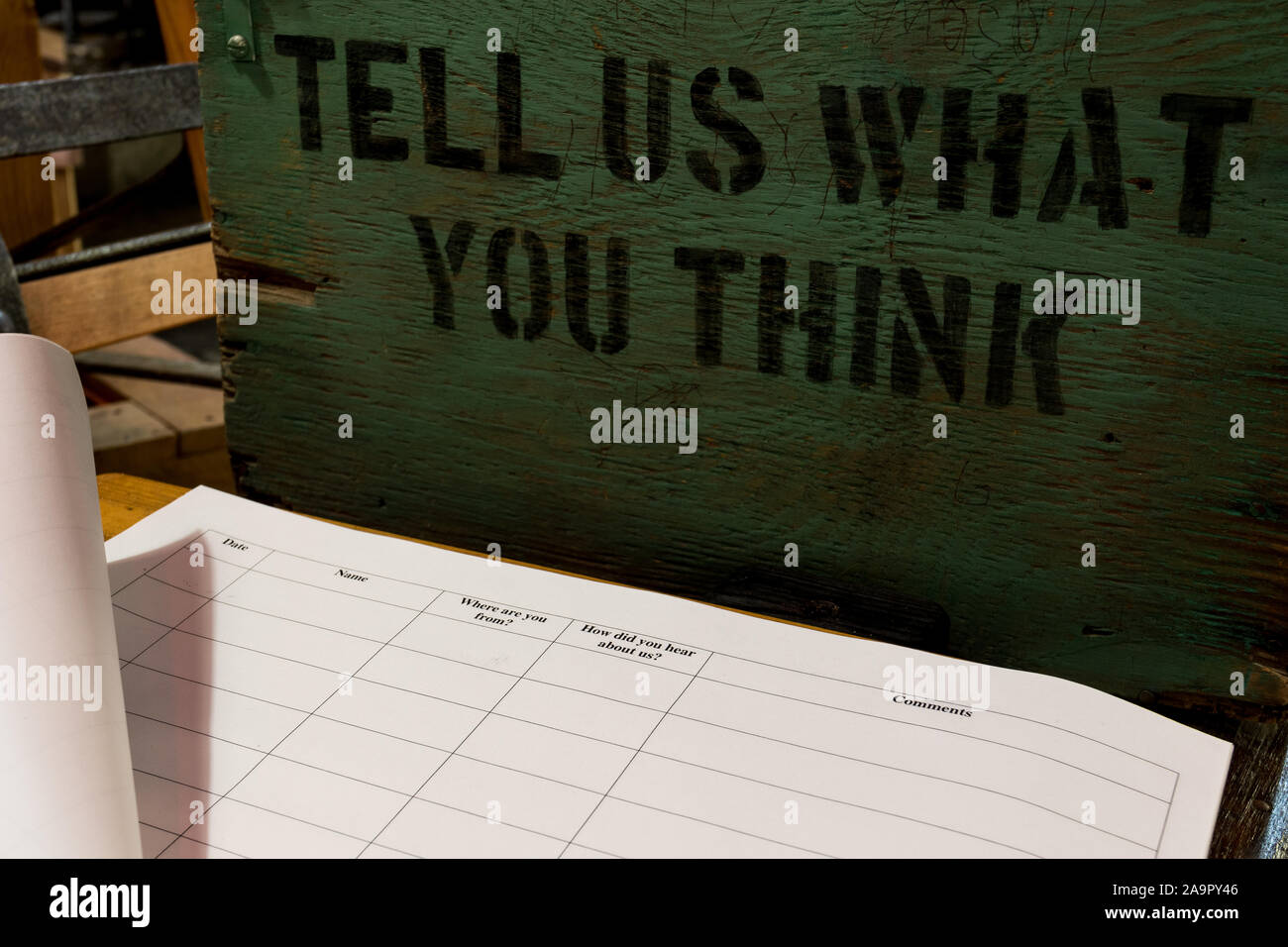 Guest book journal with old suggestion box. Tell us what you think