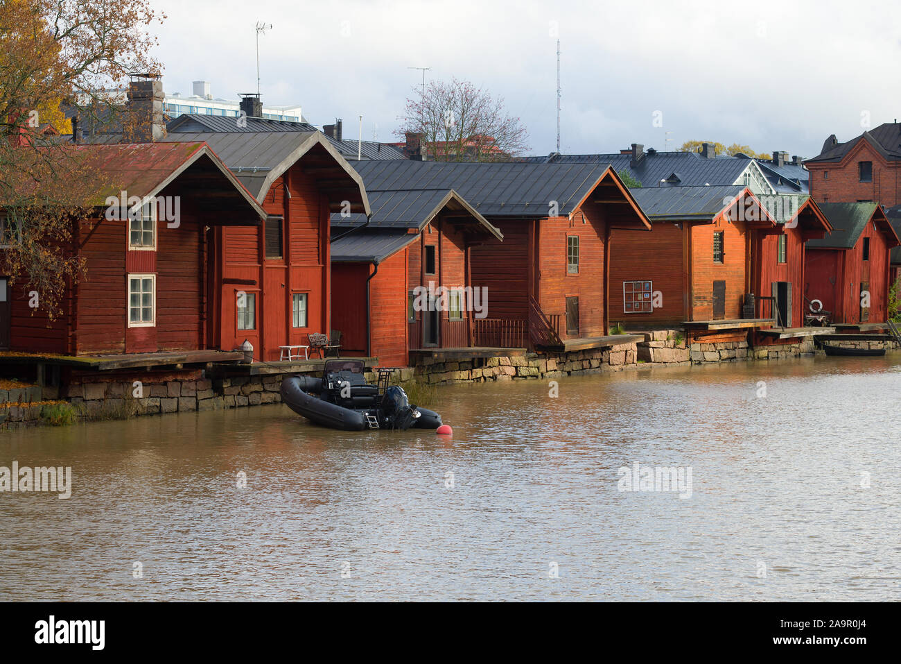 Old Red Barns On The Shore Of Porvoonjoki River On A Cloudy