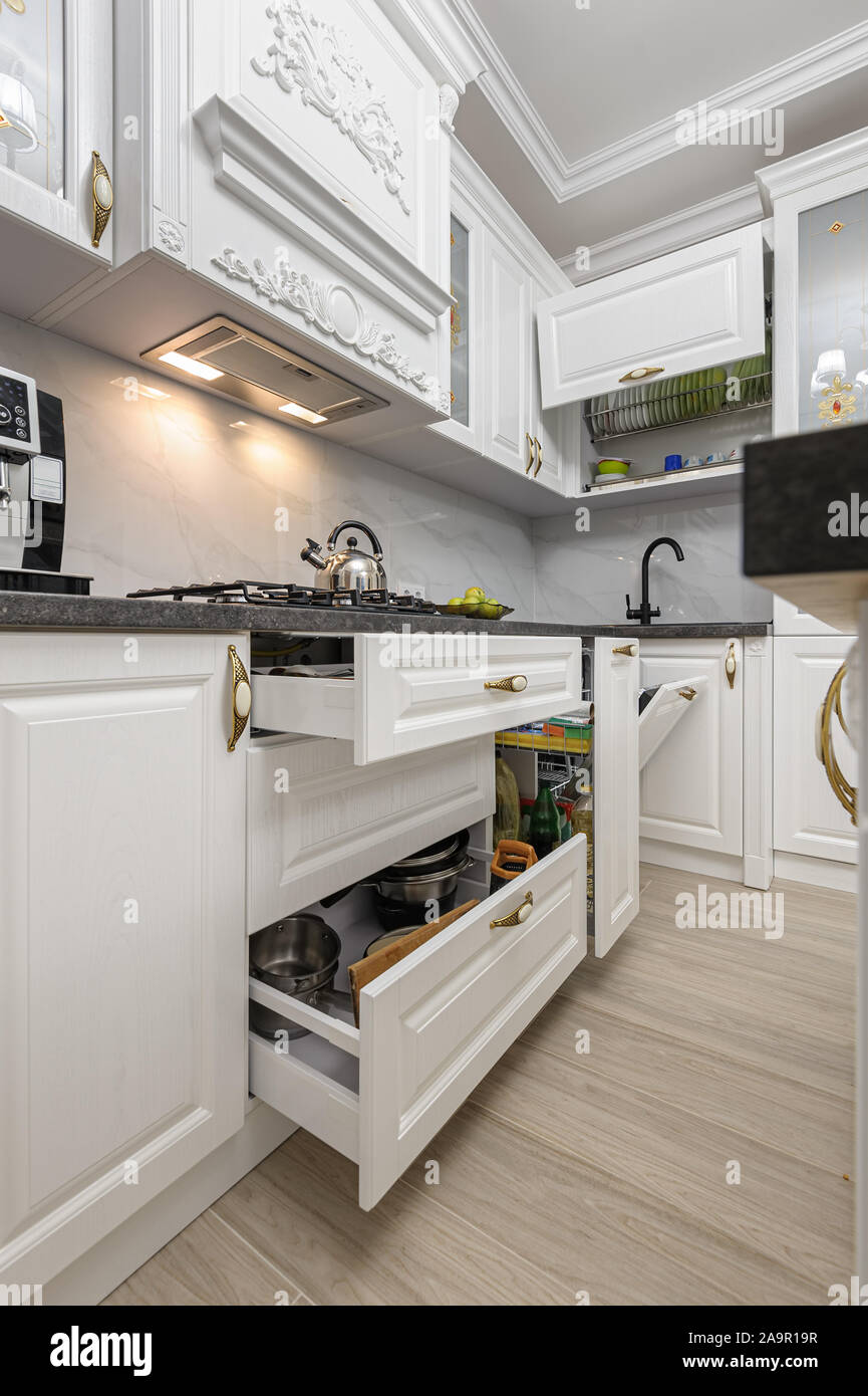 White luxury modern kitchen with island Stock Photo - Alamy