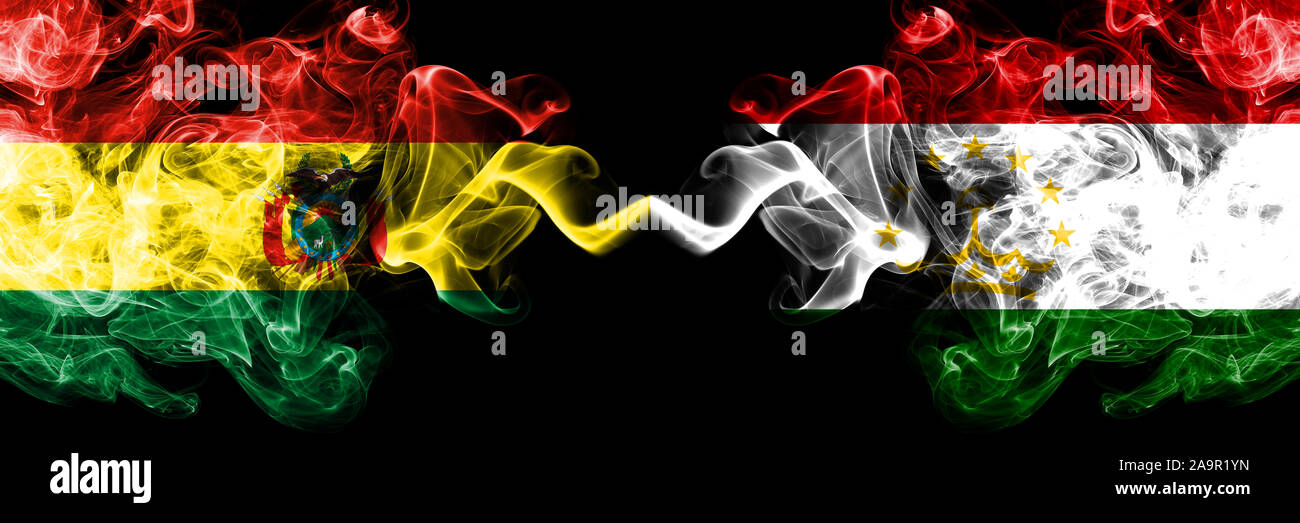Bolivia, Bolivian vs Tajikistan, Tajikistani smoky mystic states flags placed side by side. Concept and idea thick colored silky abstract smoke flags Stock Photo