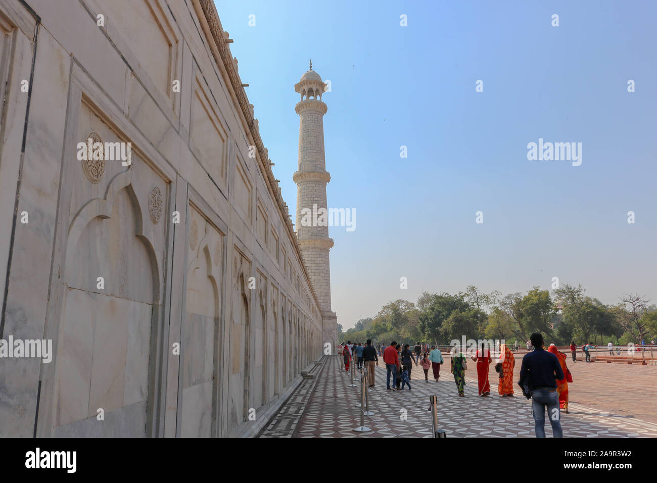Decorated marble wall leading to one of the minaret of the Taj Mahal. Taj Mahal is an ivory-white marble mausoleum on the south bank of the Yamuna. Stock Photo