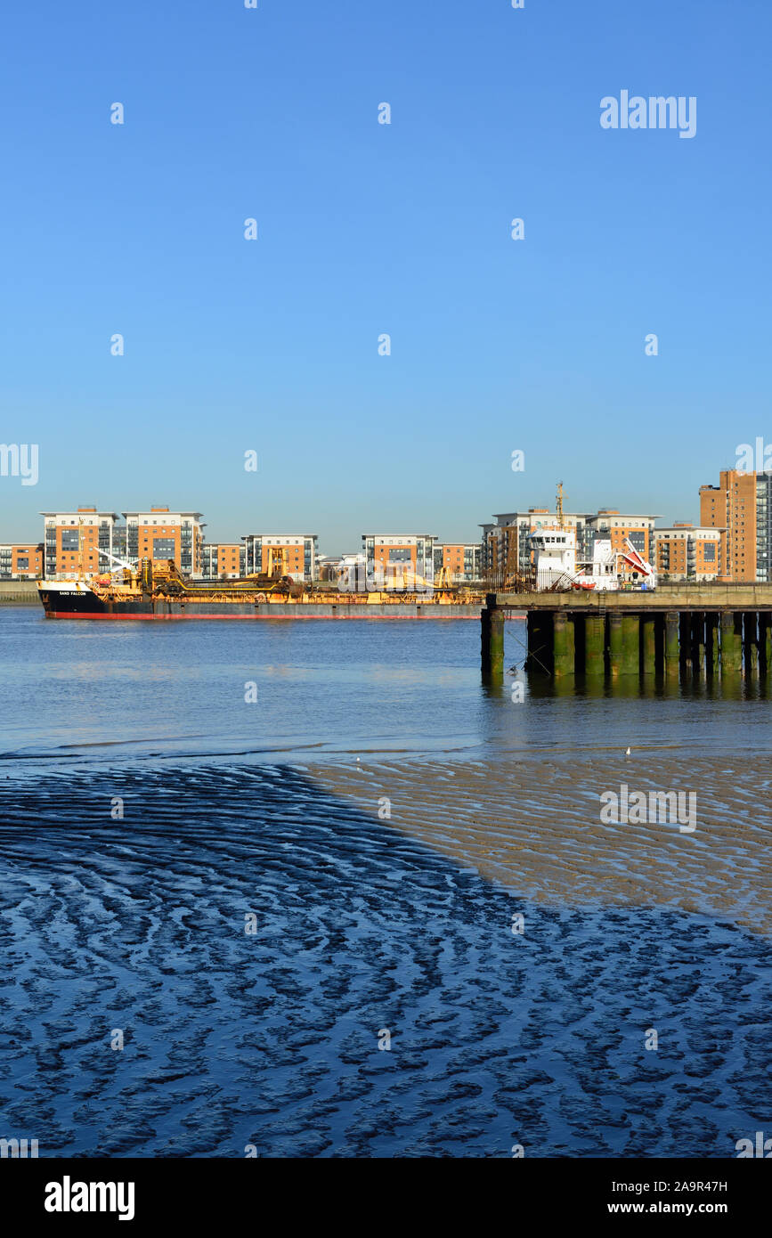 Cargo Shipping and Housing development, Thames River, Woolwich, London, United Kingdom Stock Photo