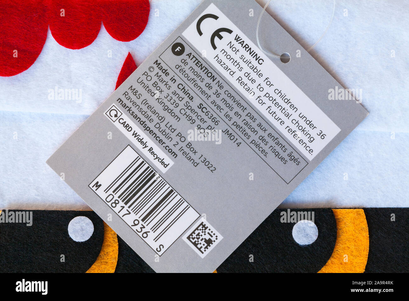 Tag with warning and CE marking symbol on M&S Treat Bags for Halloween Made in China Stock Photo
