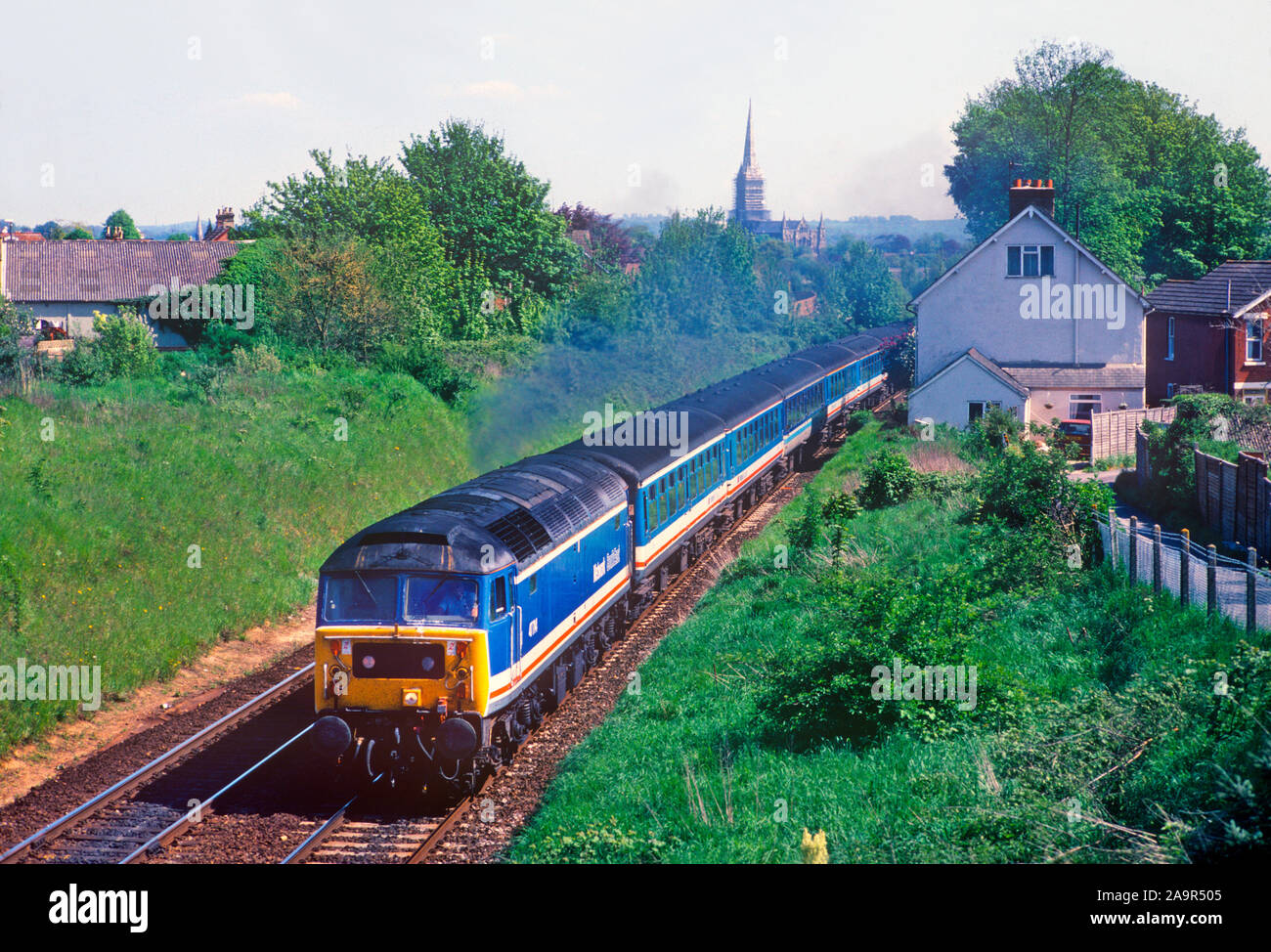 A class 47 diesel locomotive number 47714 powers away from Salisbury with Network SouthEast “Network Express” service. Stock Photo