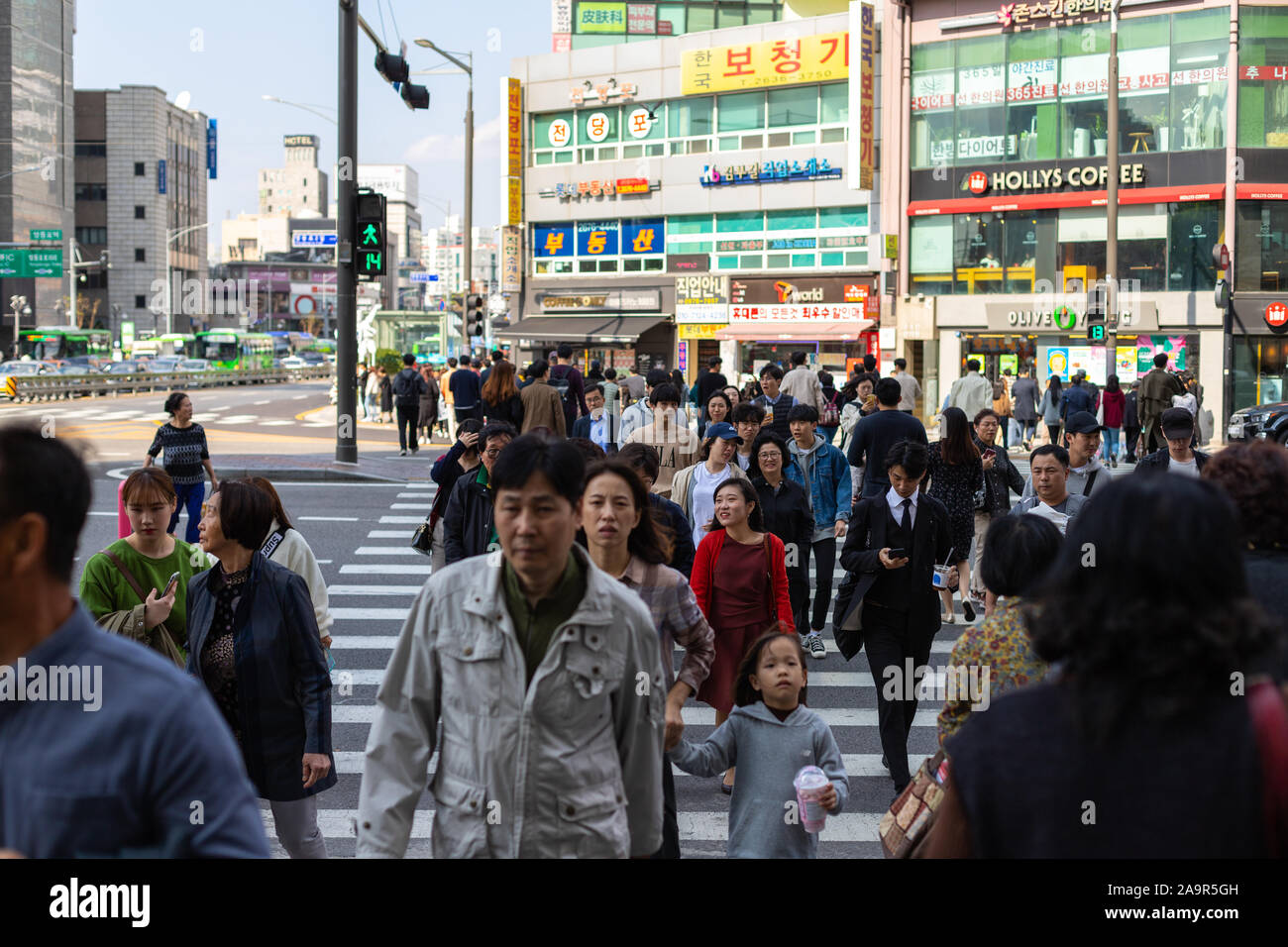 Seoul, South Korea - October 19, 2019: People cross the road. Busy intersection in the Yeongdeungpo area. Stock Photo