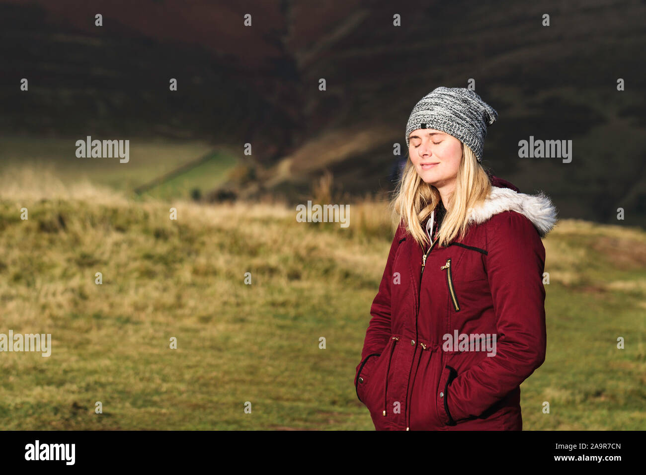 Woman Basking in Sunshine in Nature Stock Photo