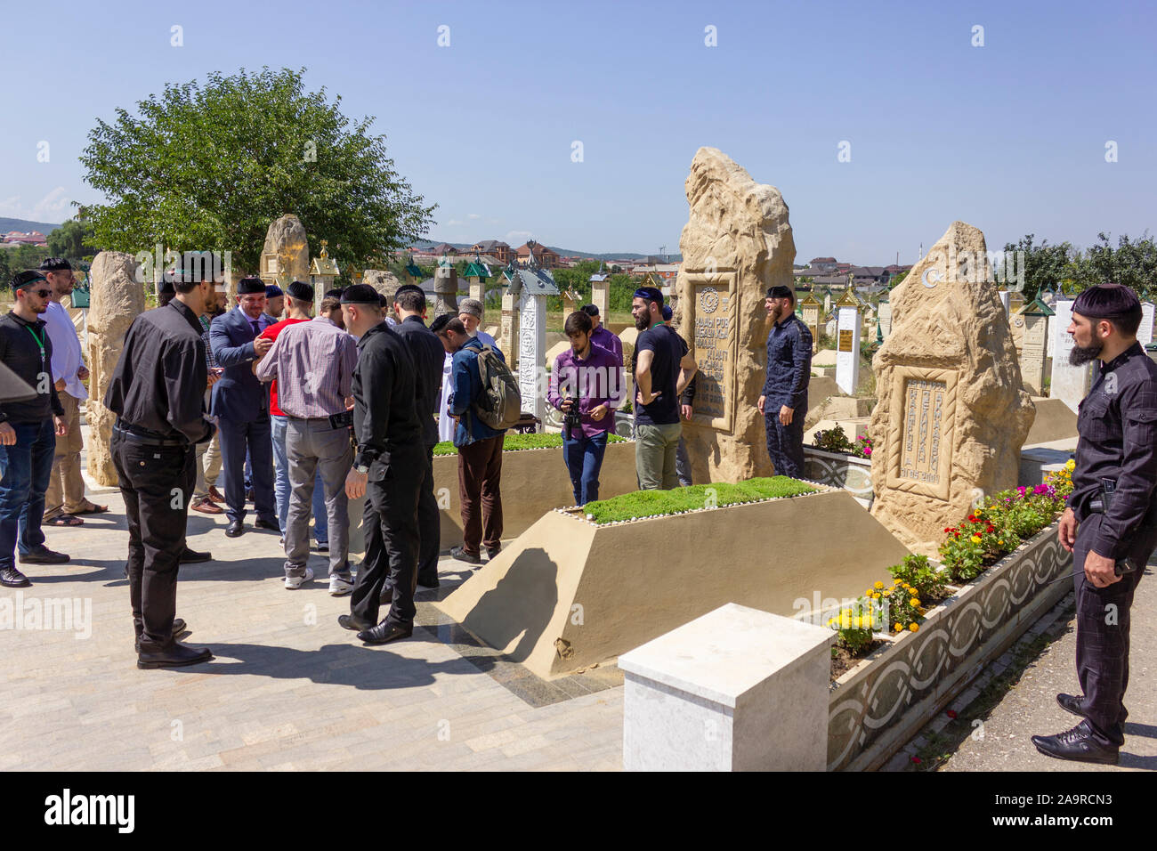 Akhmat-Yurt, Chechnya (Chechen Republic), Russia, Caucasus - august, 2019: Akhmad Kadyrov grave. youth chechen from jordan visiting Stock Photo