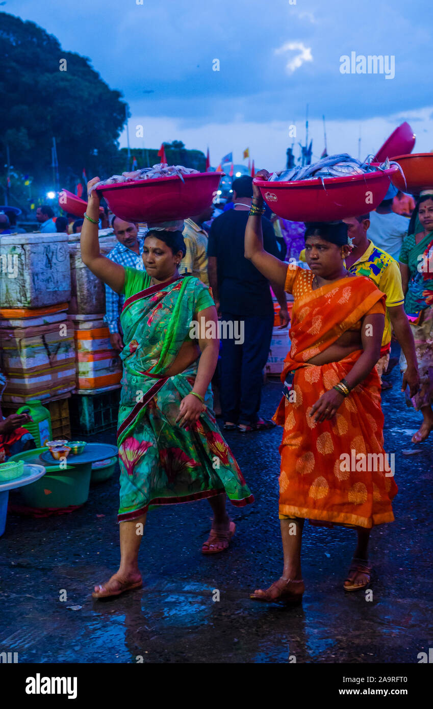 Indian people working in Sassoon Docks in Mumbai India Stock Photo