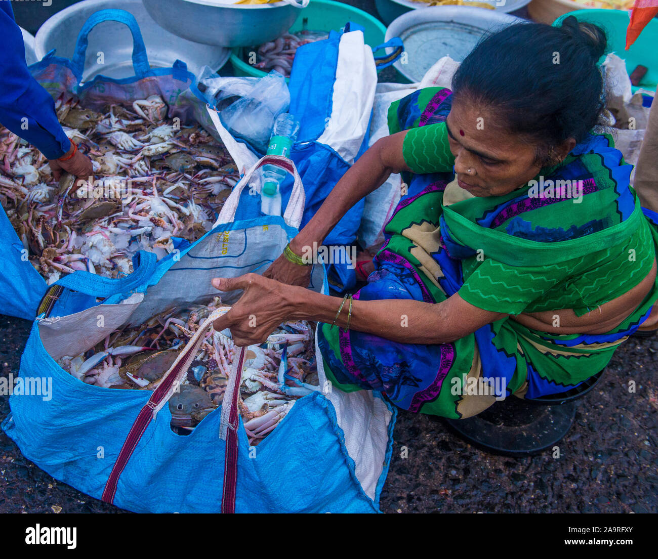 Indian people working in Sassoon Docks in Mumbai India Stock Photo