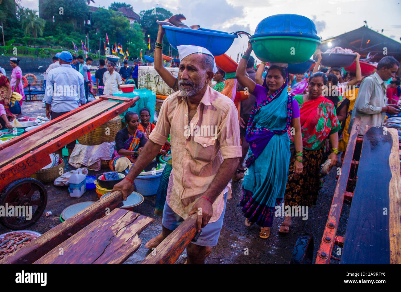 Indian people working in Sassoon Docks in Mumbai India Stock Photo