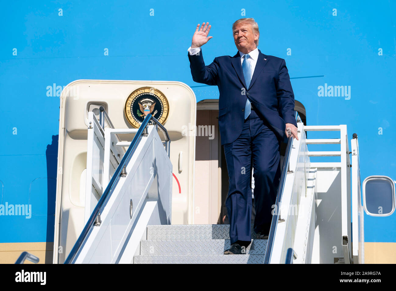 President Donald J. Trump waves as he disembarks Air Force One Wednesday, Oct. 21, 2019, at Pittsburgh International Airport in Pittsburgh. Stock Photo