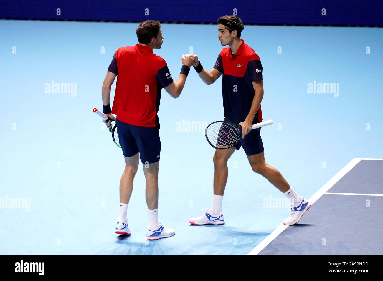 Pierre-Hugues Herbert and Nicolas Mahut (left) celebrate during the doubles final against Raven Klaasen and Michael Venus on day eight of the Nitto ATP Finals at The O2 Arena, London. Stock Photo