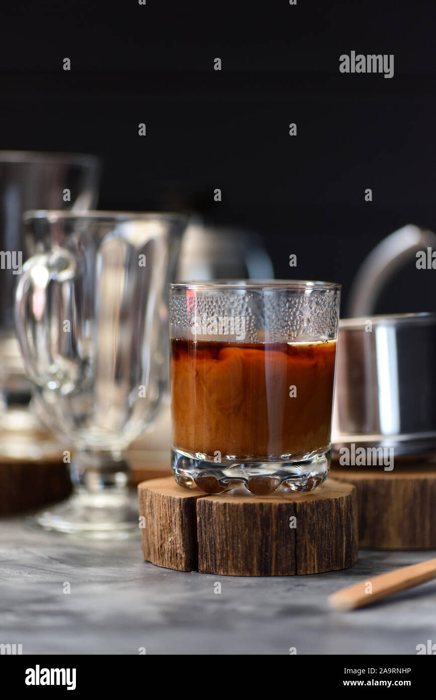 Coconut milk coffee Vietnamese style prepared in phin on dark