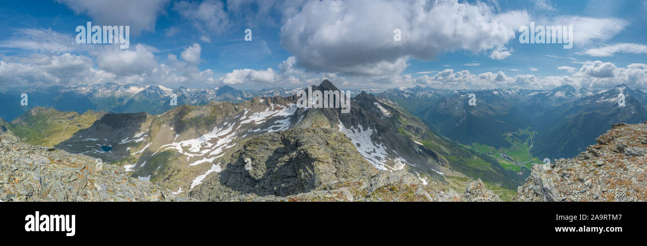 Panoramic, 180 degrees view from the summit of Picco Palu' in Valle Aurina over the Italian and Austrian Alps. Majestic views of rugged, rocky peaks. Stock Photo