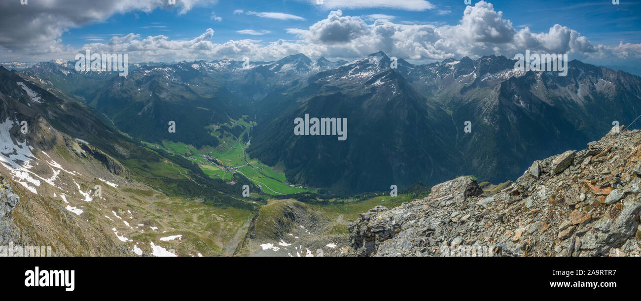 Panoramic, 180 degrees view from the summit of Picco Palu' in Valle Aurina over the Italian and Austrian Alps. Majestic views of rugged, rocky peaks. Stock Photo