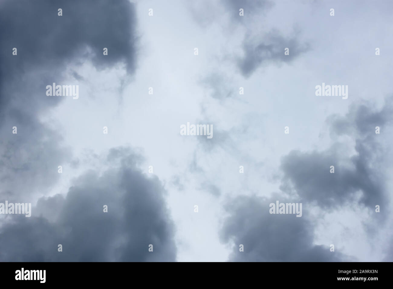 Grey and bluish tragic cloudscape with various density chaotic clouds Stock Photo