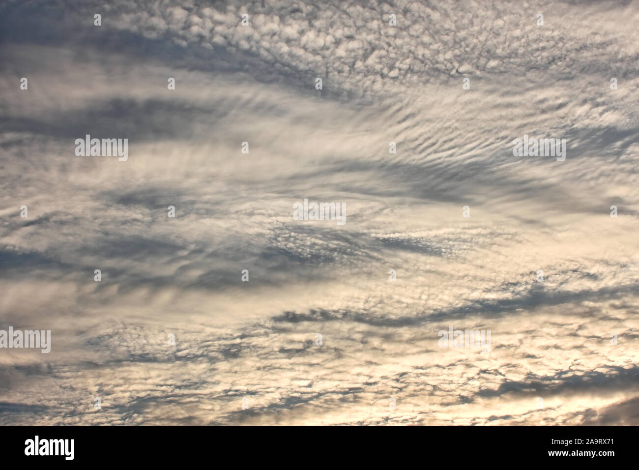 Altocumulus clouds in evening sky as a texture Stock Photo