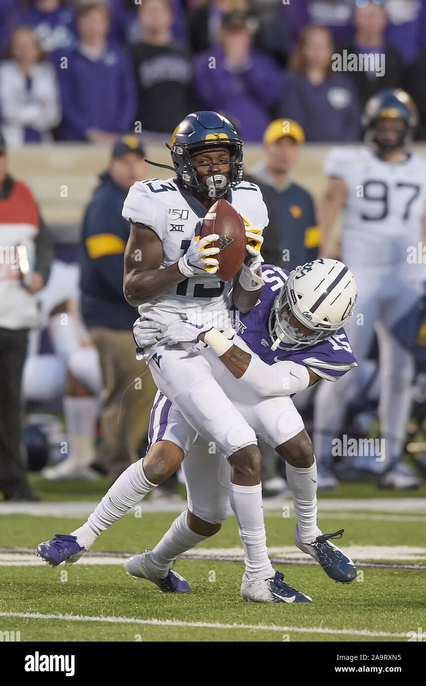 November 16, 2019: West Virginia Mountaineers wide receiver George Campbell (15) makes a catch as Kansas State Wildcats defensive back Walter Neil Jr. (15) wraps him up during the NCAA Football Game between the West Virginia Mountaineers and the Kansas State Wildcats at Bill Snyder Family Stadium in Manhattan, Kansas. Kendall Shaw/CSM Stock Photo
