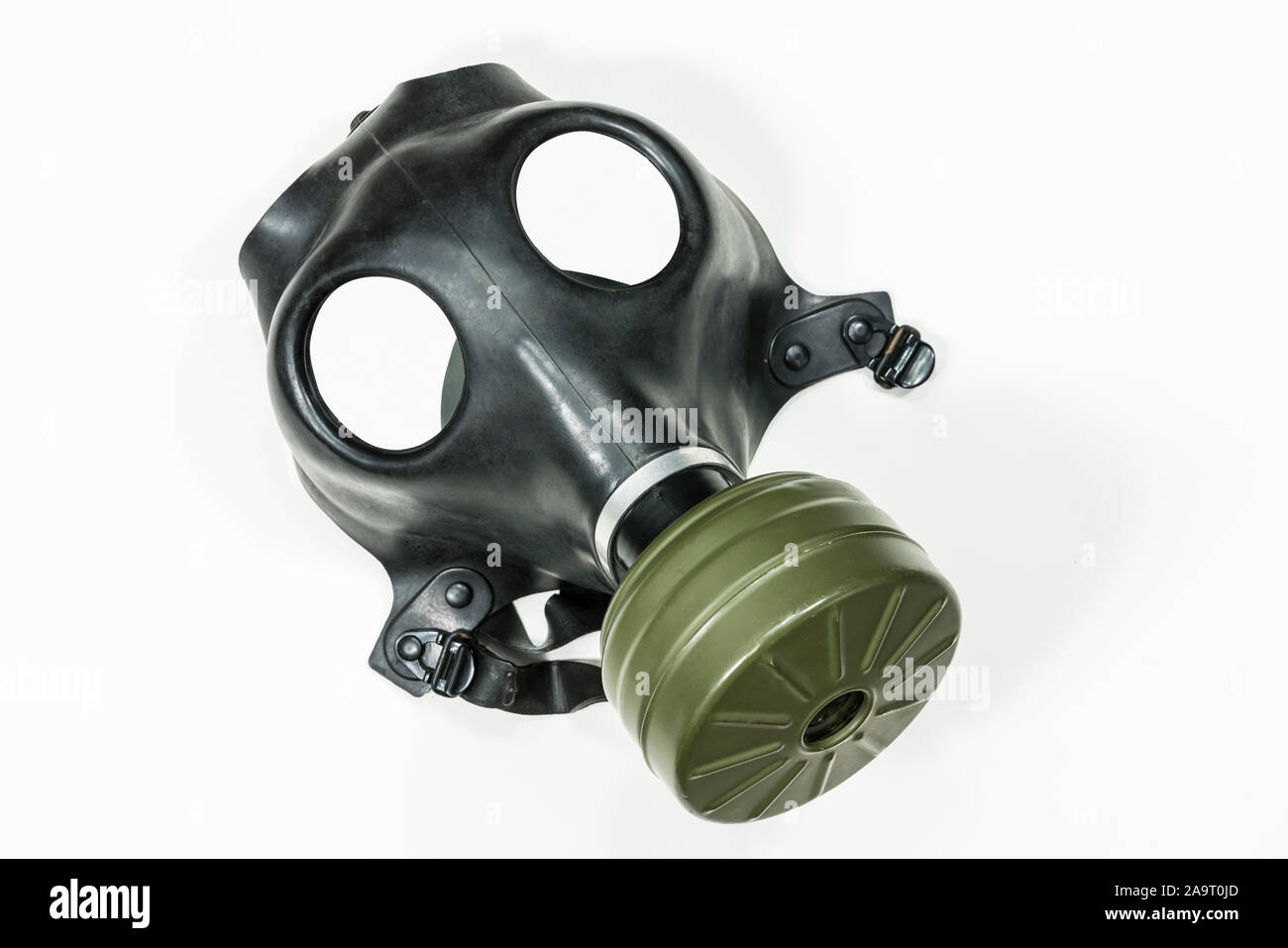 Old army surplus gas mask with white background. Stock Photo