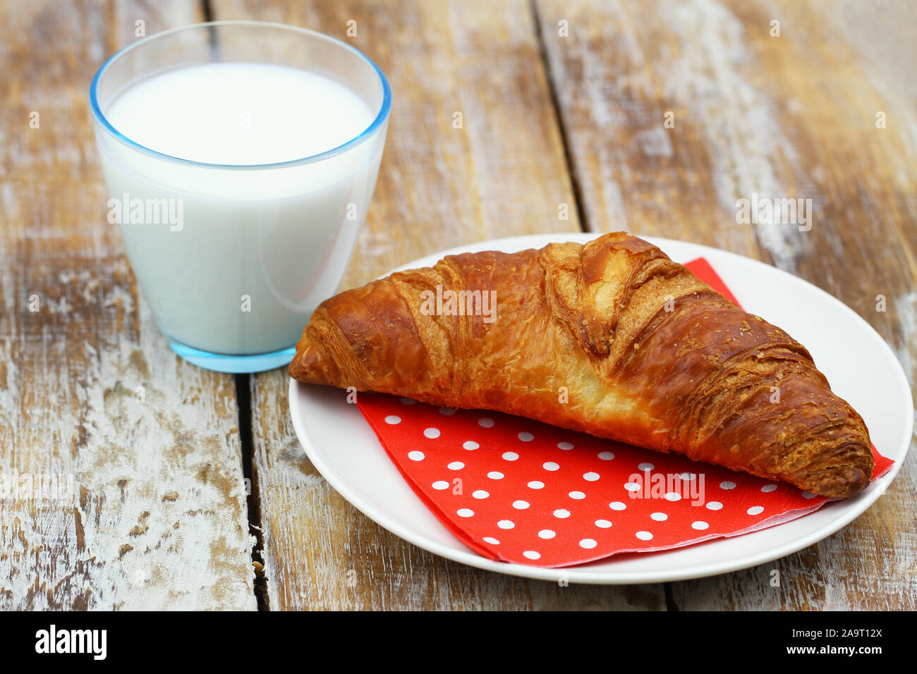 Simple breakfast: French croissant and glass of milk Stock Photo