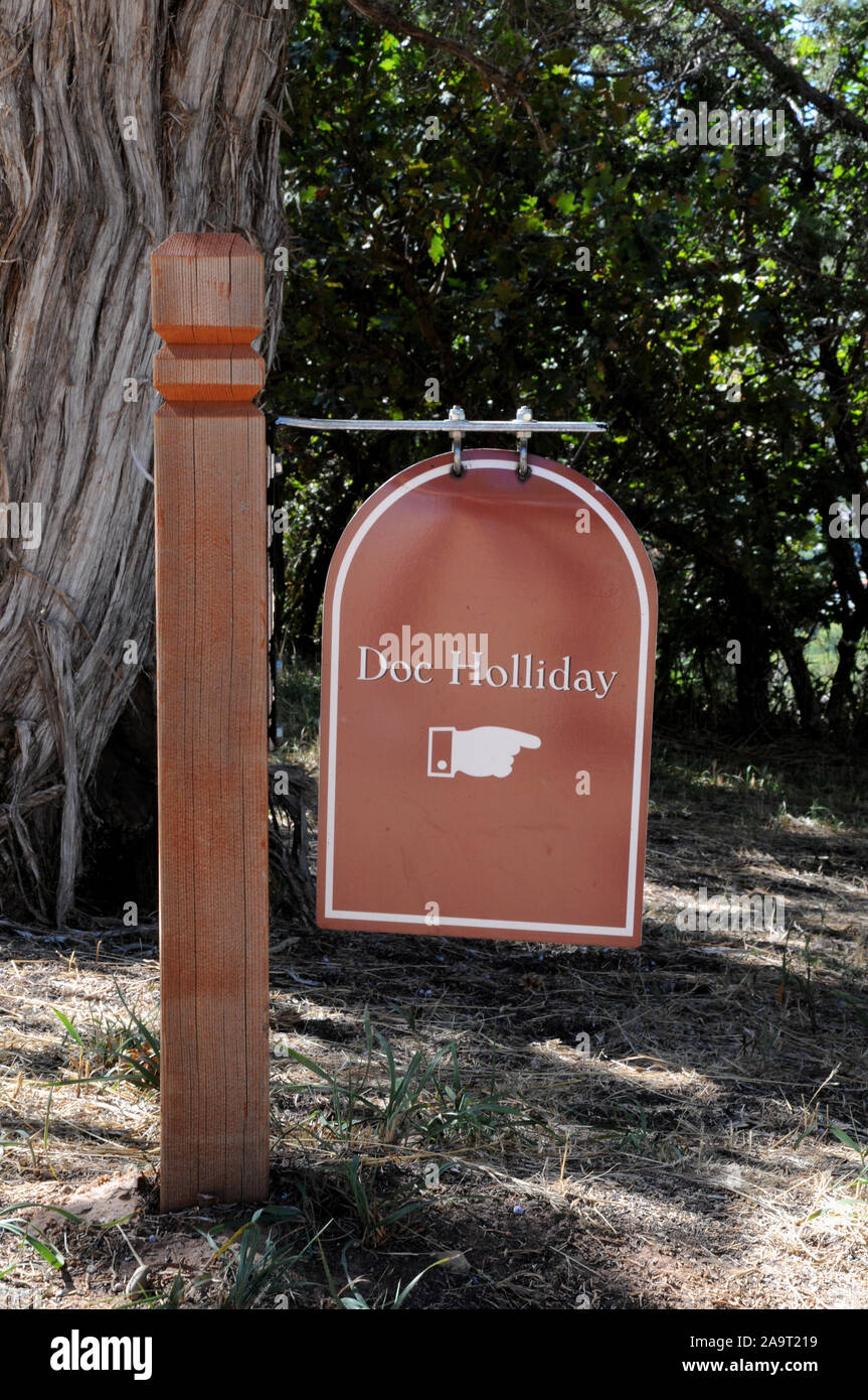 Signs at the Linwood Cemetery on a hillside above Glenwood Springs in Colorado. The signs point visitors to the graves of Doc Holliday and Kid Curry. Stock Photo