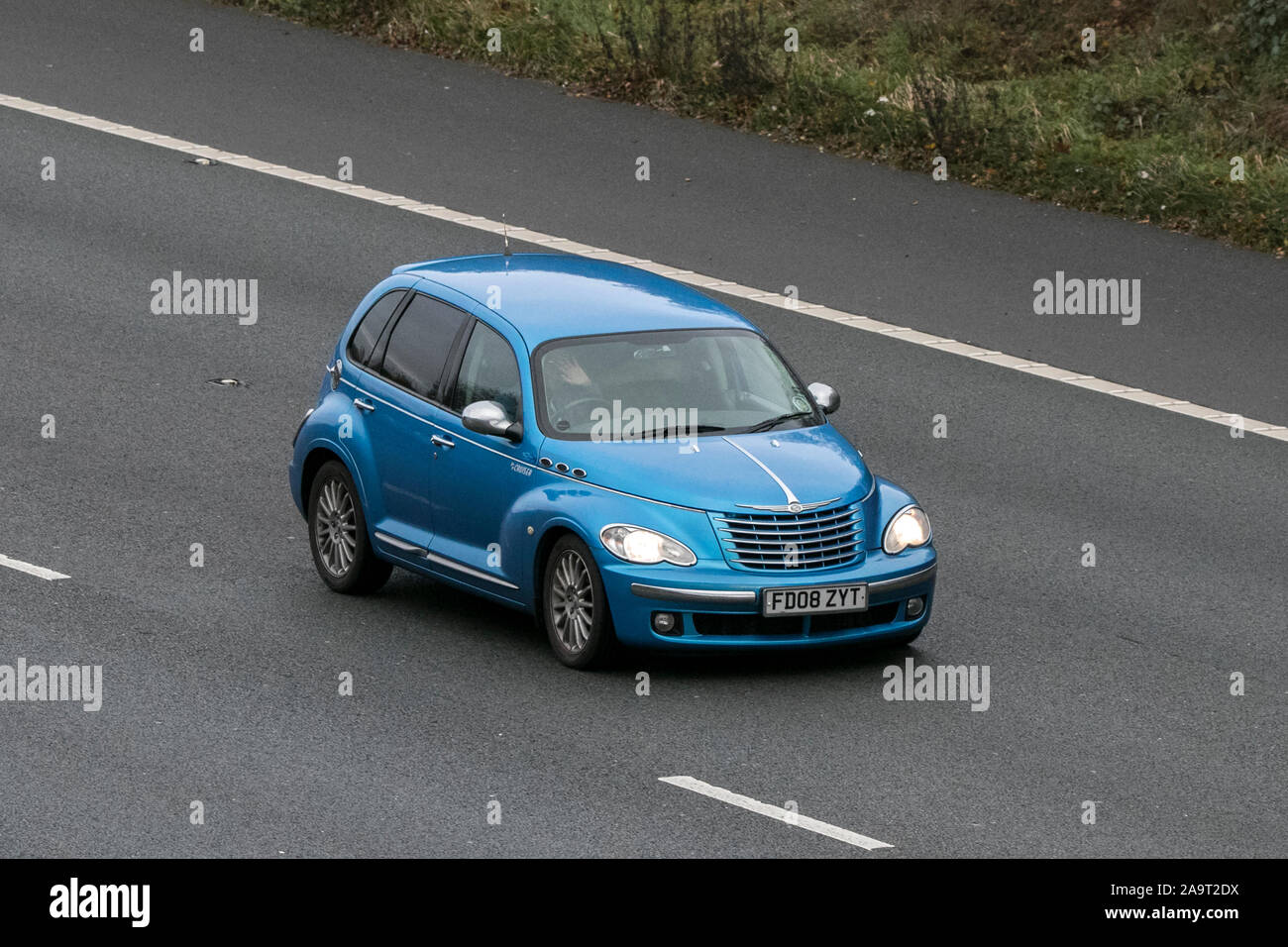 Chrysler Pt Cruiser Limited Crd saloon car traveling southbound on the M61 motorway near Manchester, UK. Stock Photo