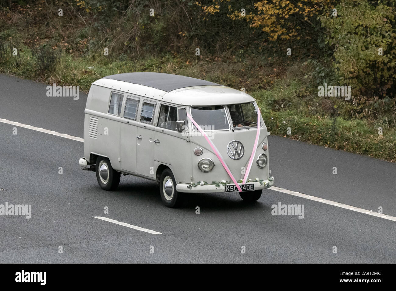 1967 60s Cream Vw split screen veteran Volkswagen; UK Vehicular traffic, old timers transport, old vehicles, classic saloon cars, on the M61. Stock Photo