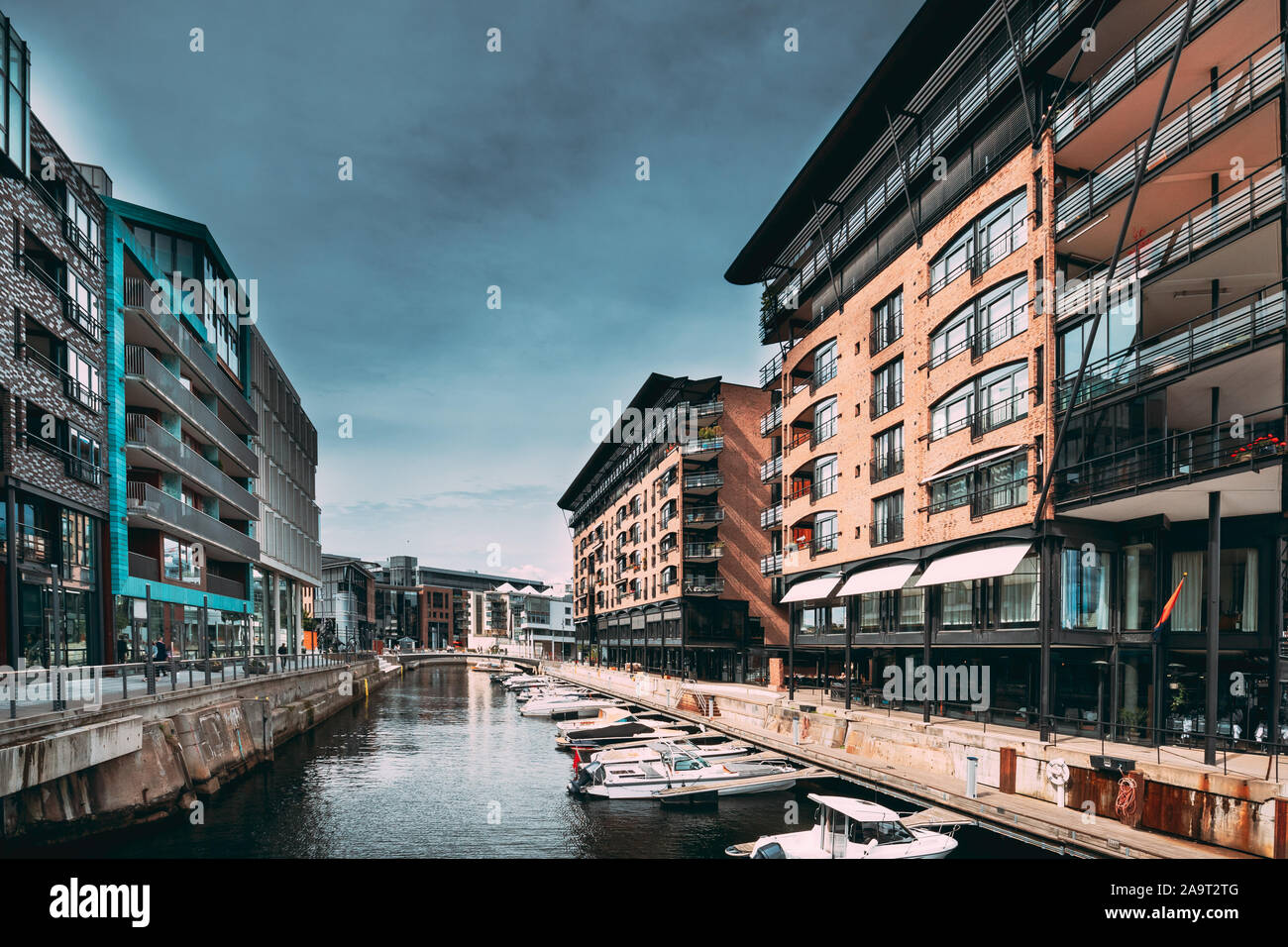 Oslo, Norway. View Of Residential Multi-storey Houses In Aker Brygge District In Summer Evening. Famous And Popular Place. Stock Photo