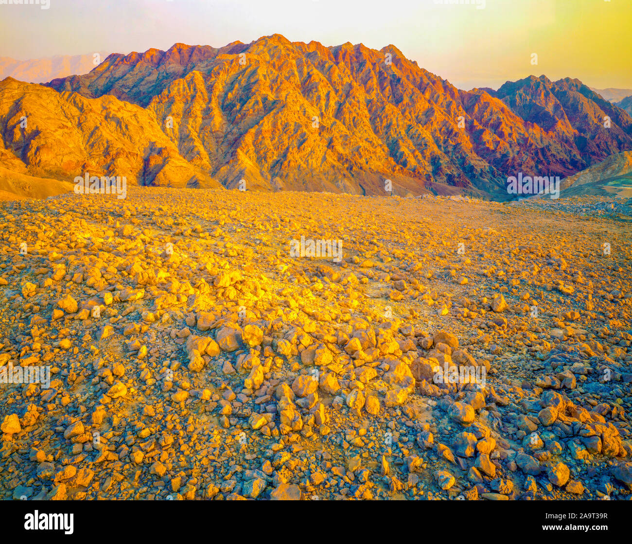 Eilat Mountains at sunset, Eilat Mountains Nature Reserve, Israel, Negev Desert, Great Syrian-African Rift, Red Sea beyond Stock Photo