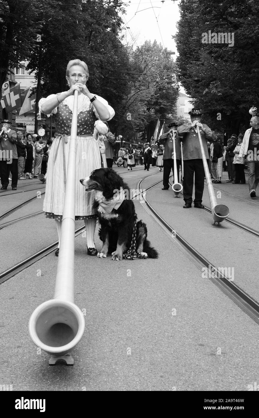 Alphorn musicians playing at Zürichs Bahnhofstreet at the swiss national day Stock Photo