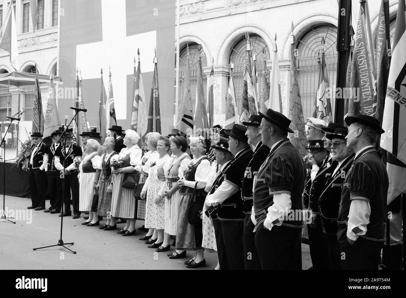 Male and female chorus of a swiss folklore group at the national day parade in Zürich-city Stock Photo