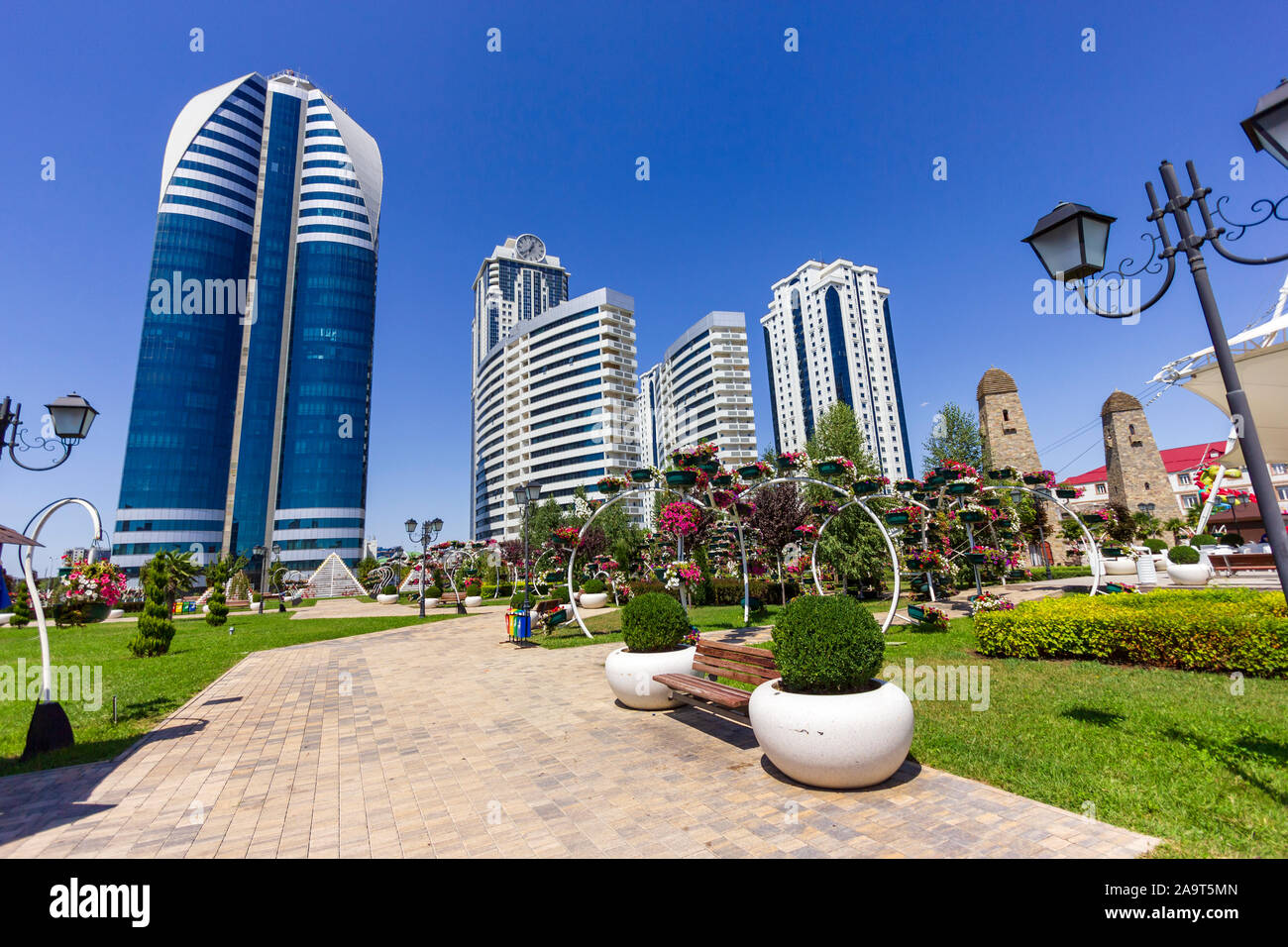 Grozny, Chechen Republic, Russia - august 12, 2019: Beautiful view of the complex of high-rise buildings of Grozny city from the Flower Park. Sunny su Stock Photo