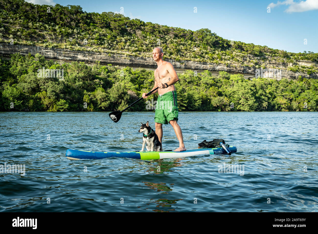 Austin, Texas, USA. 28 June, 2019. Stand Up Paddleboarding on Lake Austin. A man takes a stand up paddleboard on Lake Austin and travels from Pennybac Stock Photo