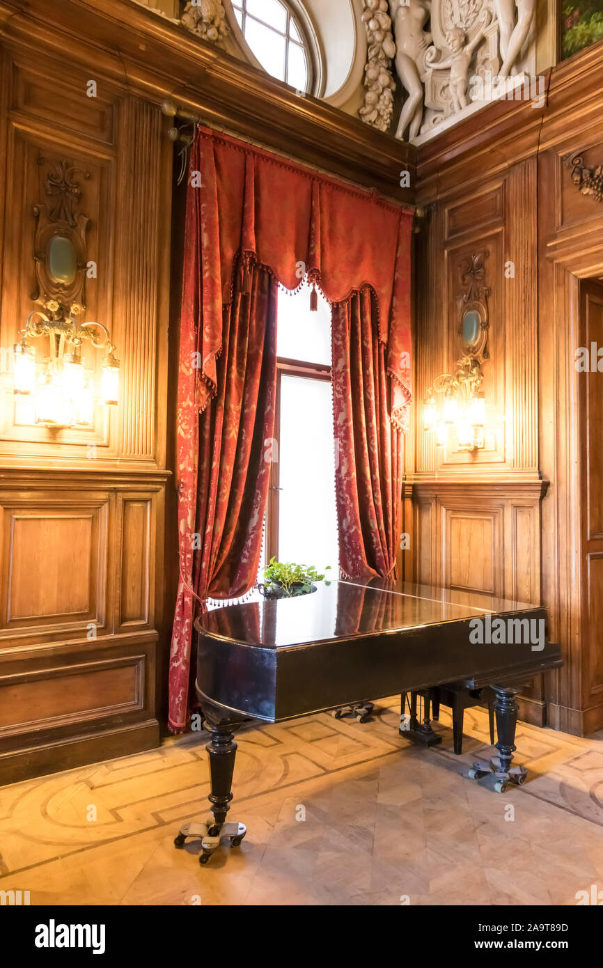 Luxury ballroom with old piano. Stock Photo