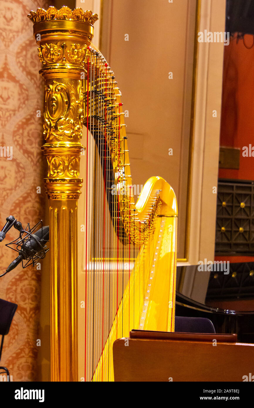 Beautiful golden harp strings close up. Musical instruments of the