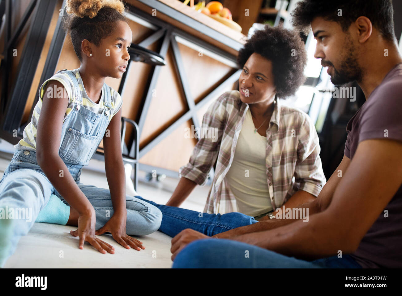 Parents having serious conversation with teenage child with problem solving attitude Stock Photo