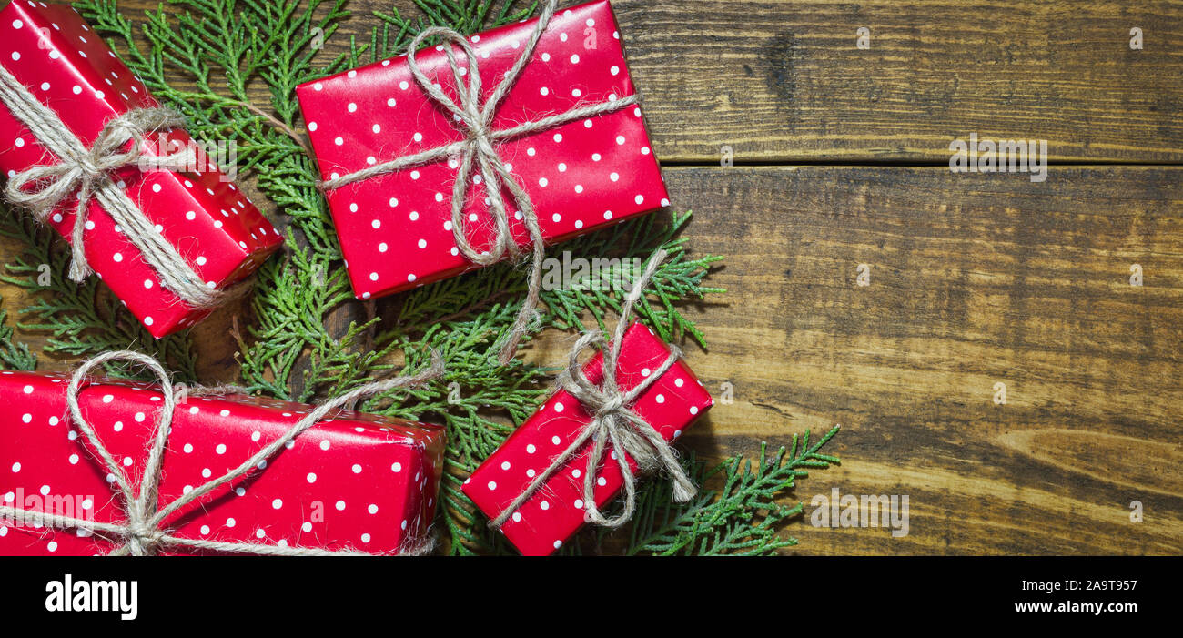 Christmas background with decorations and red gift boxes on wooden ...