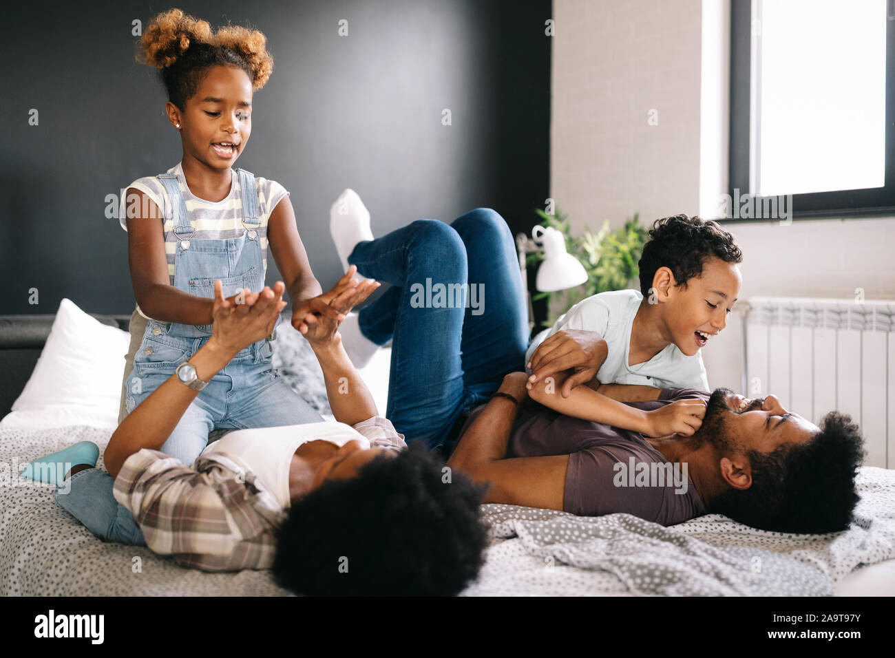 Happy black family having fun times at home Stock Photo - Alamy