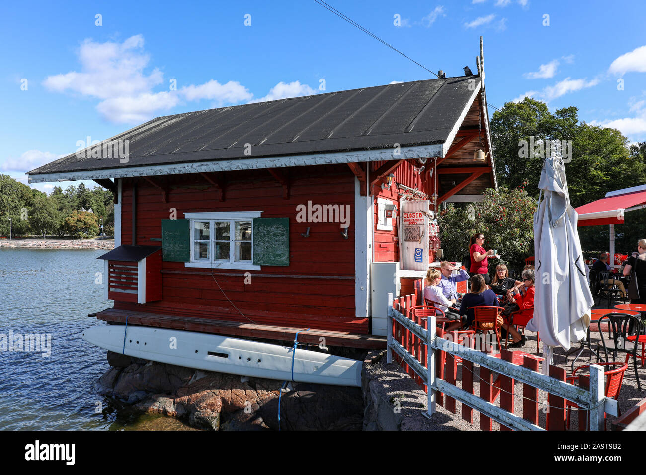 Cafe Regatta, small outdoor café by the sea, operating from 120 years old log cabin in Helsinki, Finland Stock Photo