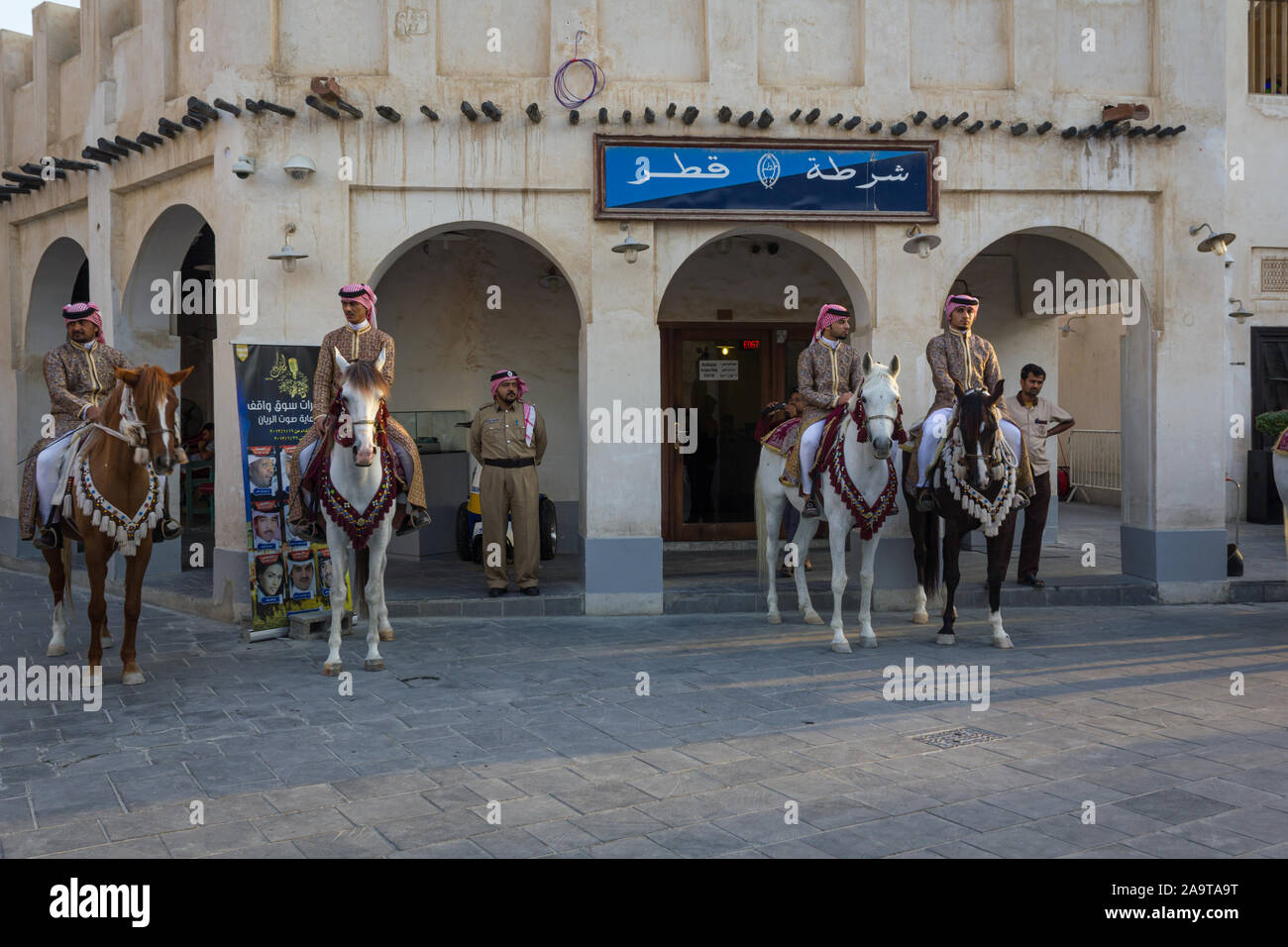 Doha-Qatar,January 24,2013: Old police station in Souk Waqif Doha Qatar daylight view with traditional guards riding horses in front of it Stock Photo