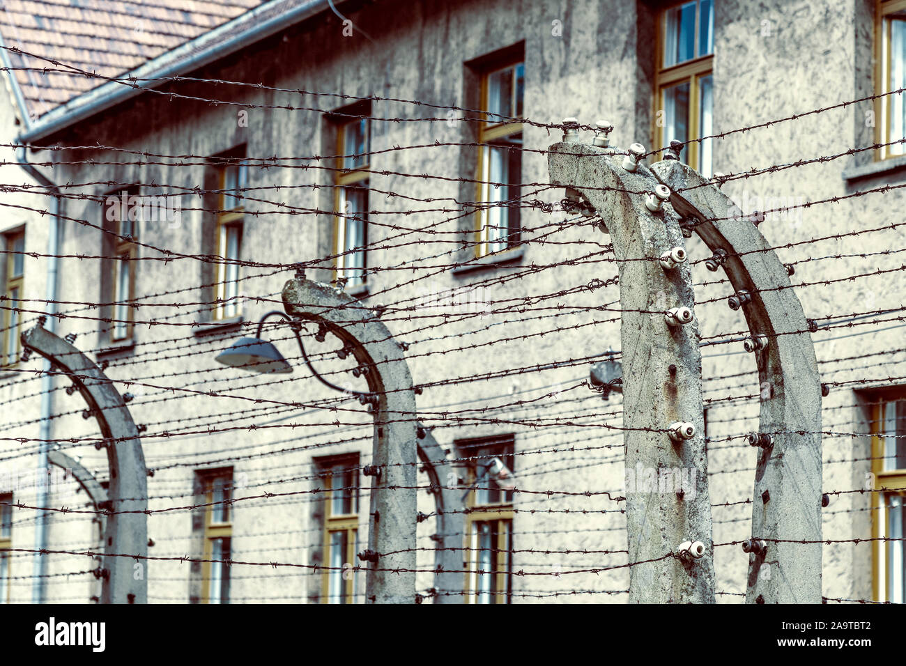 Close-up of barbwire fences for preventing prisoners from escaping at Auschwitz i concentration camp, Poland Stock Photo