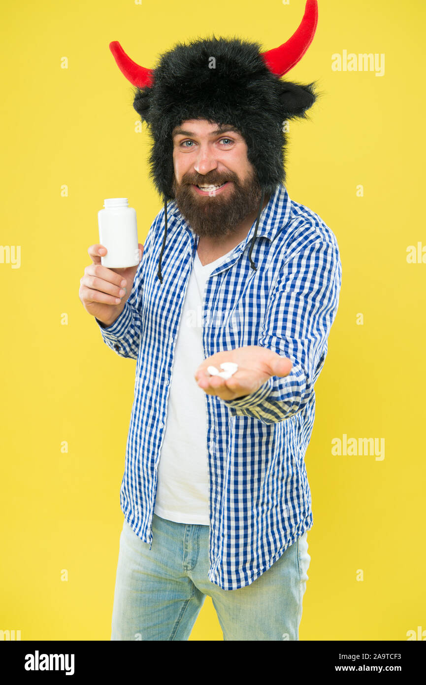 Giving drugs. Sick man take drugs. Bearded man hold drug package. Oral  drugs intake. Pills and tablets. Medication Stock Photo - Alamy